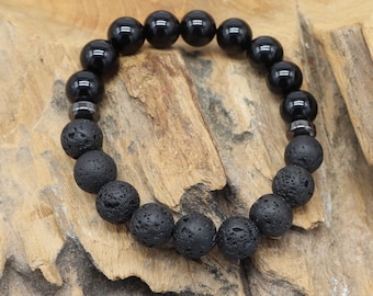 May include: Black beaded bracelet with black lava rock beads and silver metal spacers.