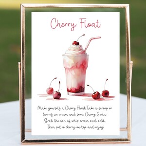 Pode incluir: Um cartaz imprimível com uma ilustração em aquarela de um float de cereja, um copo de sorvete com refrigerante de cereja e chantilly coroado com uma cereja. O cartaz inclui instruções para fazer um float de cereja: "Faça um float de cereja Pegue uma bola ou duas de sorvete e um pouco de refrigerante de cereja Pegue o pote de chantilly e adicione. Em seguida, coloque uma cereja no topo e aproveite!"