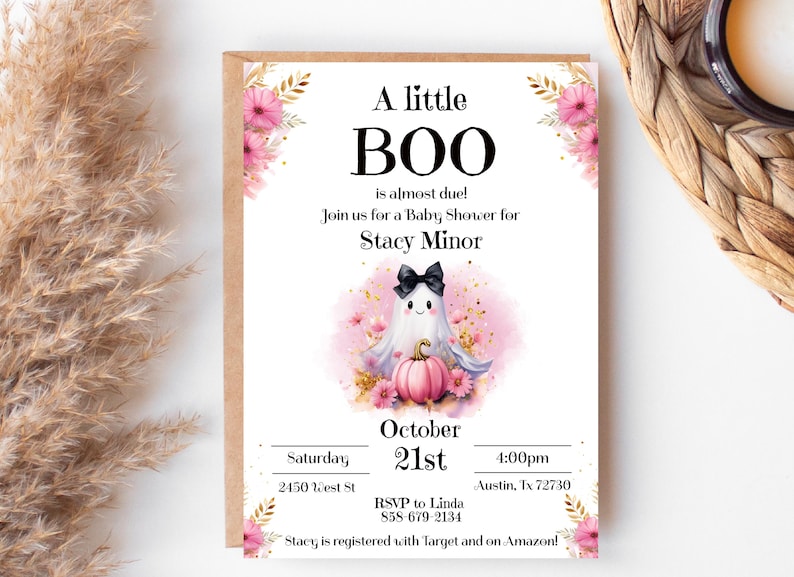 May include: A pink and white baby shower invitation with a cute ghost holding a pumpkin. The invitation says "A little BOO is almost due!" and includes the date, time, and location of the shower. It also says "Stacy is registered with Target and on Amazon!"