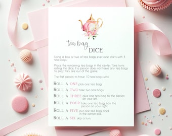 May include: A pink and white card with the text "tea bag DICE" and instructions for a tea bag game. The card is decorated with a watercolor teapot and floral elements. Pink ribbons and decorative sweets surround the card.