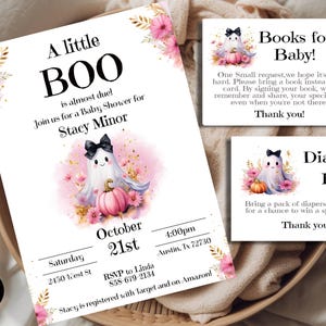 May include: A pink and gold baby shower invitation with a cute ghost illustration holding a pumpkin. The invitation says "A little BOO is almost due!" and includes the date, time, and location of the shower. It also includes the name of the guest of honor, Stacy Minor, and a request for guests to bring a book instead of a card.