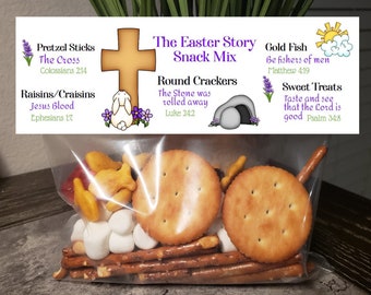 May include: A clear plastic bag filled with a variety of snacks, including pretzels, crackers, goldfish crackers, and marshmallows. The bag is labeled "The Easter Story Snack Mix" and includes bible verses related to the Easter story.