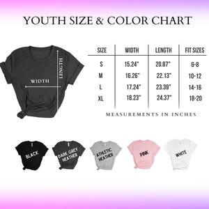 May include: A youth size and color chart displays a dark gray t-shirt with width and length measurements in inches. The chart includes sizes S, M, L, and XL, with corresponding measurements and fit sizes. Color options include black, dark grey heather, athletic heather, pink, and white.