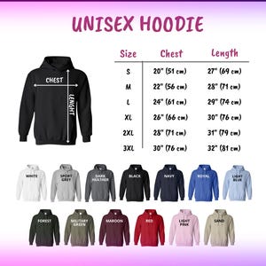 May include: A black unisex hoodie with size and measurement details. Chest measurements range from 51 cm to 76 cm, and the length measurements range from 69 cm to 81 cm. Available in various colors, including white, grey, navy, and red.