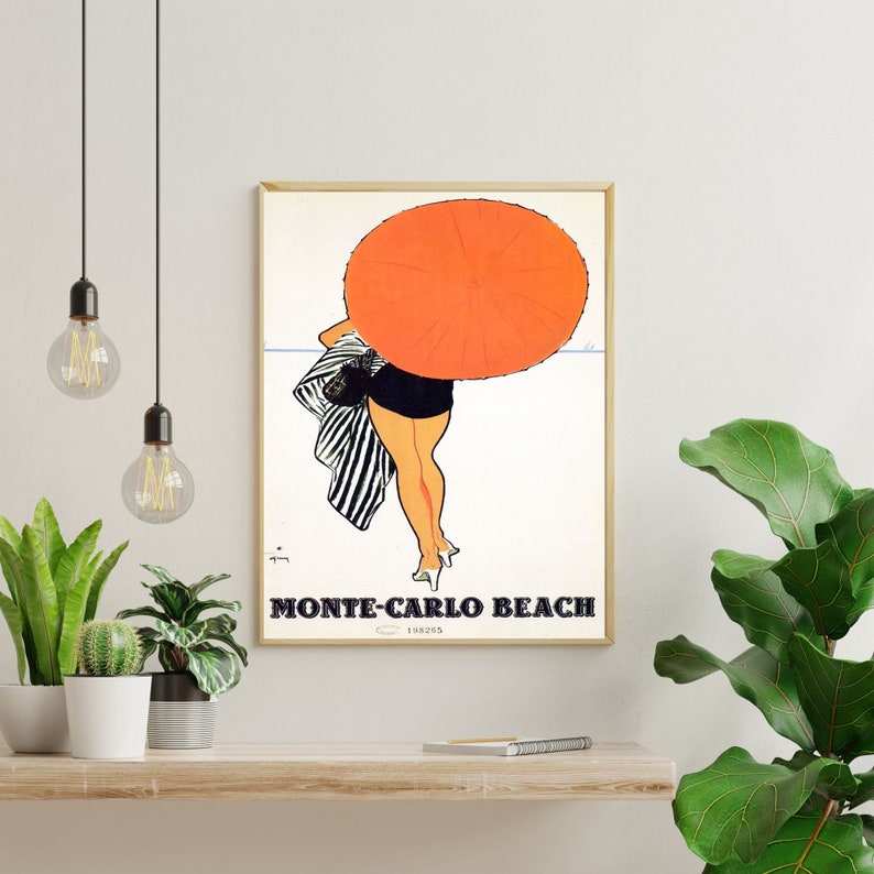 May include: A vintage travel poster advertising Monte-Carlo Beach. The poster features a woman in a black and white striped swimsuit holding a large orange umbrella.