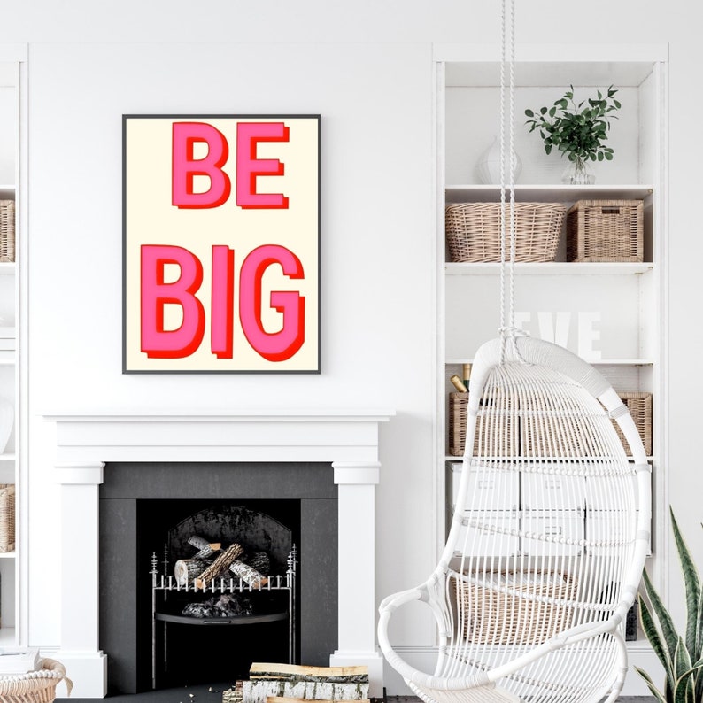May include: A white framed poster with the words "BE BIG" in pink letters on a cream background.