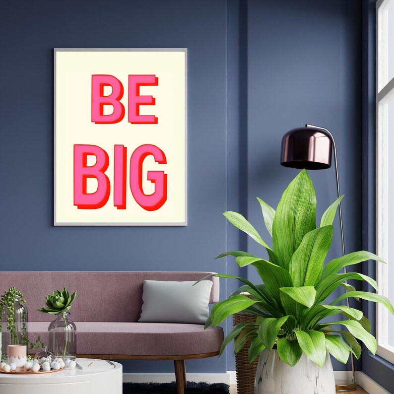 May include: A white framed print with a cream background and the text "BE BIG" in pink letters with a red outline.