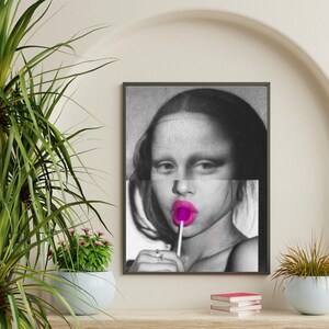 May include: A black and white portrait of a woman with a pink lollipop in her mouth. The woman's face is partially obscured by a black and white pattern.