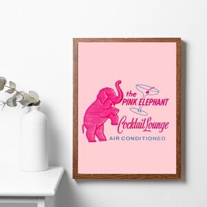 May include: A pink elephant illustration with its trunk raised, holding a martini glass with a cherry. The text reads "the PINK ELEPHANT Cocktail Lounge AIR CONDITIONED".