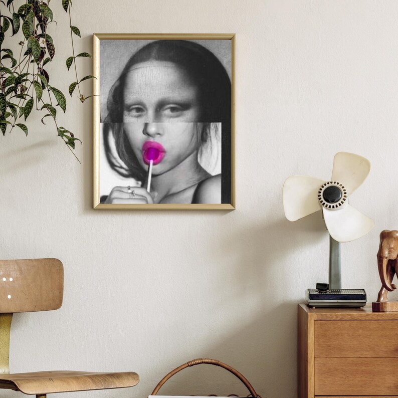 May include: Black and white portrait of a person with a pink lollipop in their mouth. The person's face is partially obscured by a horizontal line.
