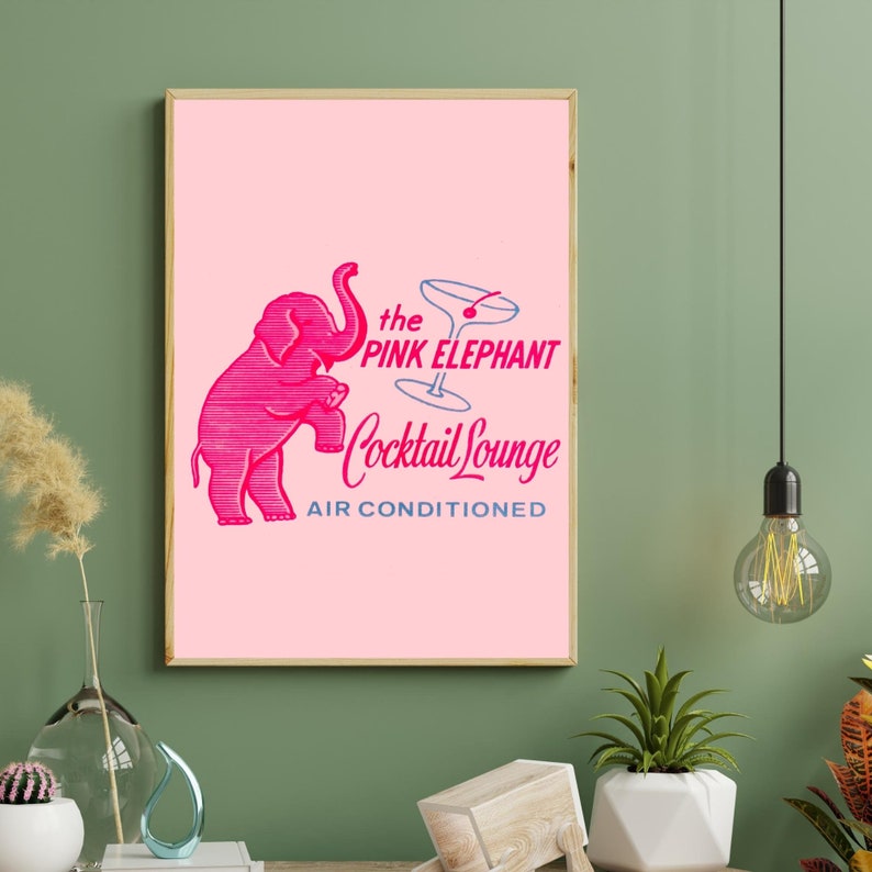 May include: A pink vintage style illustration of an elephant holding a martini glass with a cherry. The text reads "the PINK ELEPHANT Cocktail Lounge AIR CONDITIONED".