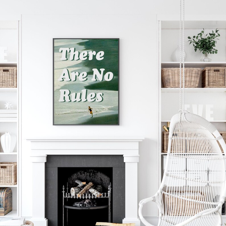May include: A framed print with the text "There Are No Rules" in white letters on a green and blue background. The print features a person running on a beach.
