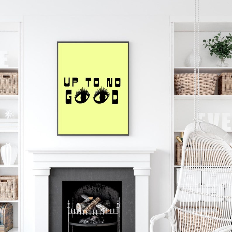 May include: A yellow poster with black text and illustrations. The text reads "Up to no good" with two black eyes with eyelashes.
