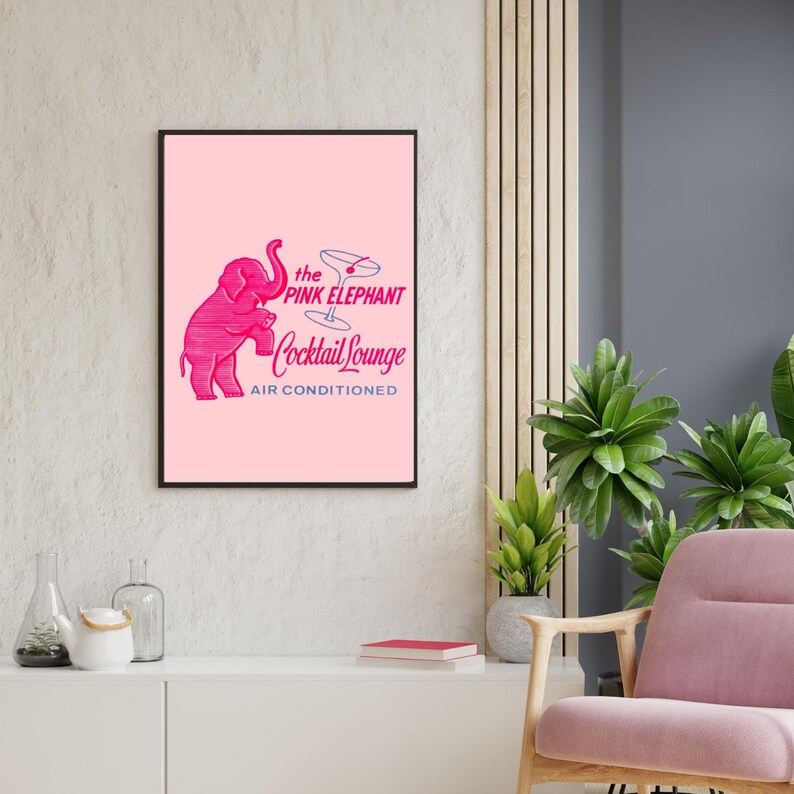 May include: A pink framed print with a pink elephant illustration and the text "the PINK ELEPHANT Cocktail Lounge AIR CONDITIONED".