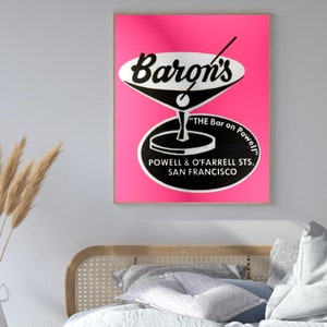 Puede incluir: Un letrero vintage de color rosa y negro para Baron's "The Bar on Powell" ubicado en Powell & O'Farrell Sts., San Francisco.