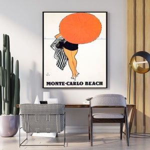 May include: A vintage travel poster featuring a woman in a black and white striped swimsuit walking away from the camera on a beach. She is holding a large orange umbrella. The text "Monte-Carlo Beach" is printed in black at the bottom of the poster.