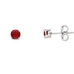 May include: A pair of stud earrings featuring round, vibrant red gemstones set in a silver-colored metal. One earring is shown face-on, the other is shown from the side, displaying the post and butterfly backing. The earrings are set against a white background.
