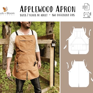 Może przedstawiać: Brązowy fartuch z płótna z dużą kieszenią i dwiema mniejszymi kieszeniami. Fartuch ma regulowane szelki i rozcięty tył. Fartuch jest pokazany na osobie, która go nosi w ogrodzie. Tekst "APPLEWOOD APRON" i "SIZES 2 YEARS TO ADULT - TWO DIFFERENT FITS" jest pokazany u góry obrazu.