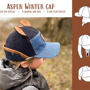 May include: A blue denim winter cap with brown ear flaps and a brown brim. The cap has a brown patch on the top with a white outline. The cap is being worn by a child.