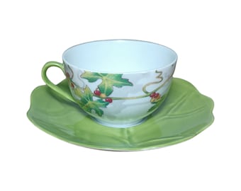 Beautiful cup from the French brand Du Lys Royal Limoges with a leaf-shaped stand is for sale. Unique.