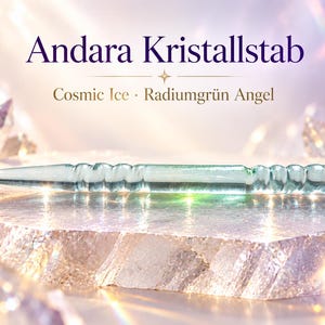 May include: A translucent, pale green glass wand with a pointed tip and a textured, ribbed handle. The text "Andara Kristallstab" and "Cosmic Ice · Radiumgrün Angel" is displayed above the object, which rests on a jagged, crystalline surface.