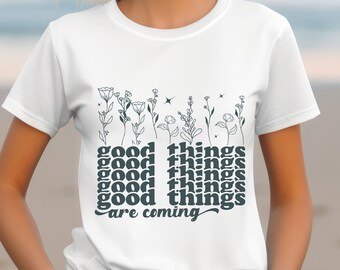 Vintage blommig t-shirt: Retro t-shirt med grafisk "Goda saker kommer"