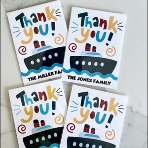 May include: Four white rectangular paper envelopes labeled Cruise Tipping Envelopes. Each features a graphic of a black cruise ship on blue waves, the text Thank you!, and personalized family names or stateroom numbers in black sans-serif font.