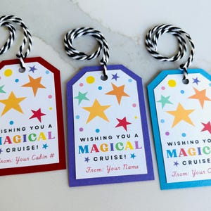 May include: Three colorful cruise gift tags with a star and dot design. Each tag has a different border color: red, purple, and blue. The text reads "Wishing you a Magical Cruise!" and includes space for personalization.