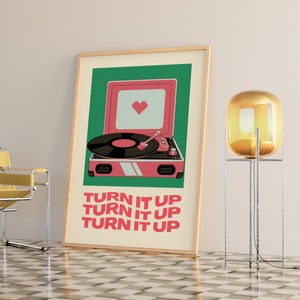 May include: A green and pink poster with a retro record player and the text "TURN IT UP" repeated three times.