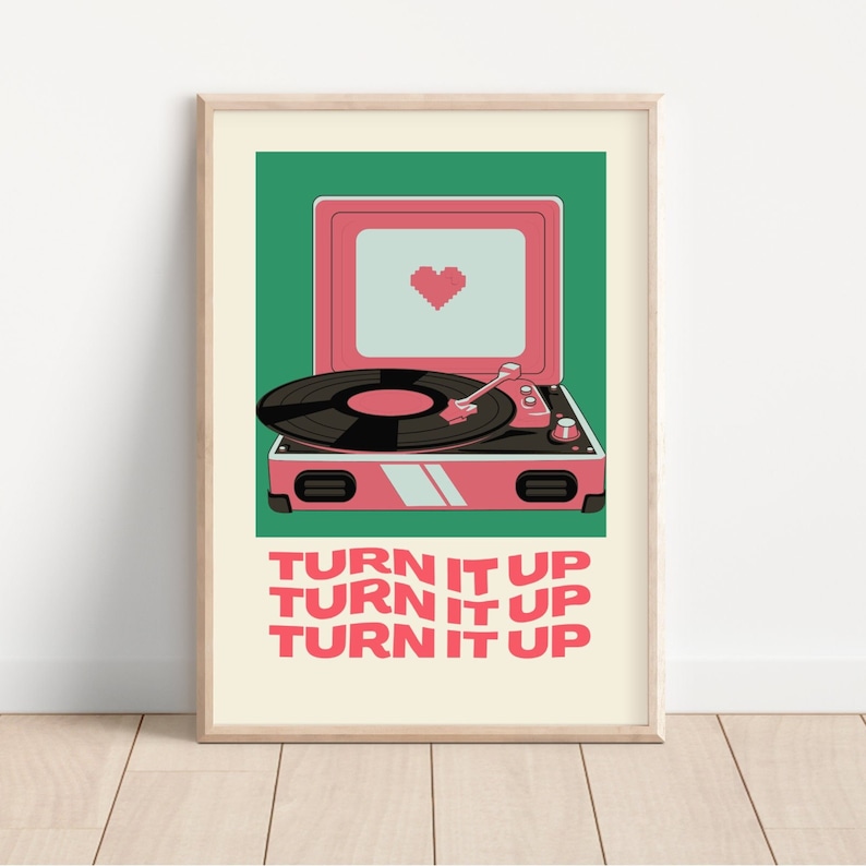 May include: A pink record player with a green background. The record player has a heart-shaped screen and the text "TURN IT UP" is repeated three times in pink.