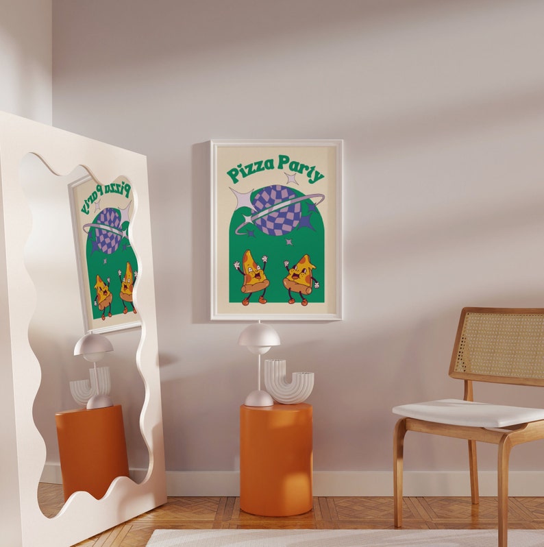 May include: A framed print with the words "Pizza Party" in green and white. The artwork features two cartoon pizza slices dancing under a purple and checkered planet. The background is a light beige color.