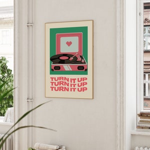 May include: A retro-style poster with a pink record player and the text "TURN IT UP" repeated three times. The record player has a green background and a heart in the speaker.