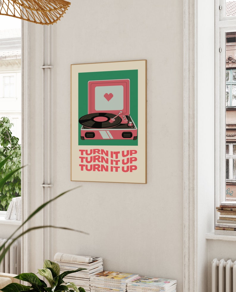 May include: A retro-style poster with a pink record player and the text "TURN IT UP" repeated three times. The record player has a green background and a heart in the speaker.