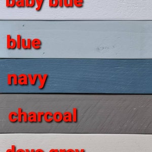 May include: A colour chart showing 11 different paint colours, from black to white. The colours are: black, sage, baby pink, baby blue, blue, navy, charcoal, dove grey, ecru, off white, and white.