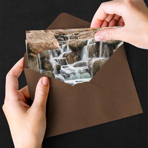 Waterfall Print wall art instant download of a soft waterfall gently flowing over the rocks in a mockup of the image printed on a greeting card.