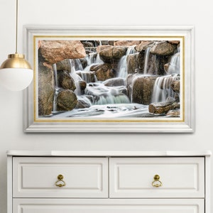 Waterfall Print wall art instant download of a soft waterfall gently flowing over the rocks in a mockup of the image framed and hanging over a dresser.