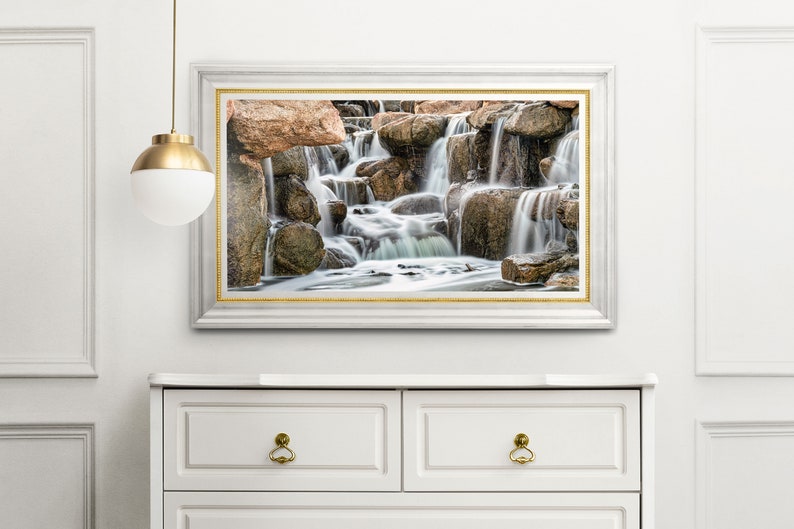 Waterfall Print wall art instant download of a soft waterfall gently flowing over the rocks in a mockup of the image framed and hanging over a dresser.
