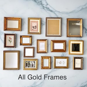 May include: An assortment of gold picture frames in different shapes and sizes, displayed on a marble-effect wall. Some frames contain artwork or mirrors. The text "All Gold Frames" is visible at the bottom of the image.