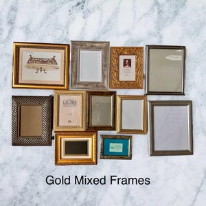 May include: A selection of gold mixed frames in various sizes and styles. The frames feature different textures and finishes, including ornate, textured, and simple designs. The image includes the text "Gold Mixed Frames".