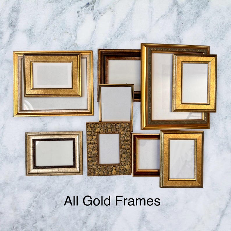 May include: A collection of gold picture frames in different shapes and sizes, displayed on a marble-effect background. The frames vary in design and texture, with the words "All Gold Frames" visible at the bottom.