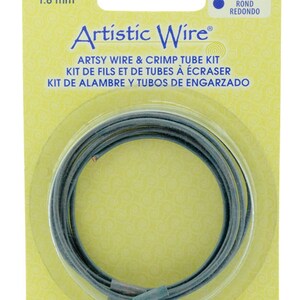 May include: A package of Artistic Wire artsy wire and crimp tube kit. The package is yellow with a clear plastic window showing a roll of gray wire. The package includes 3 feet (0.91 meters) of wire and 5 crimp tubes. The package also includes the text "Round, Rond, Redondo" and "14 Gauge Calibre 1.6 mm".