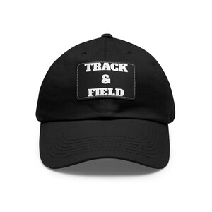 May include: A black baseball cap with a white patch that says "TRACK & FIELD" on it.