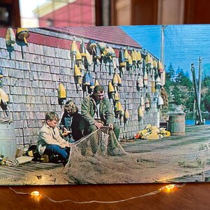 Handmade In Maine Vintage Image Of Fisherman Repairing Nets With His Children On Pine Wood