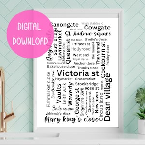 May include: A black and white word cloud print featuring the names of streets and places in Edinburgh, Scotland. The words are arranged in a circular pattern with the words "Dean Village" and "Cowgate" at the top and bottom of the print.