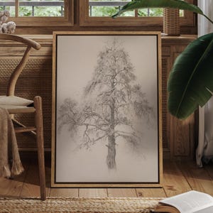 May include: A framed pencil drawing of a large tree with detailed branches and foliage. The artwork is in a natural wood frame, displayed against a neutral background. The drawing is in shades of gray and brown, creating a realistic depiction of the tree.
