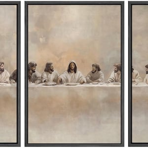 May include: A triptych artwork depicting the Last Supper. The painting features a table with figures in robes, set against a soft, neutral background. The artwork is framed in black.
