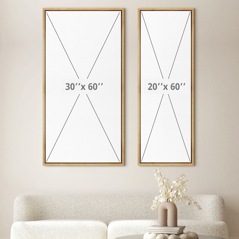 May include: Two rectangular canvas art pieces with wooden frames. The larger canvas is labeled "30" x 60"" and the smaller one is labeled "20" x 60"". The artwork is displayed above a beige sofa, with a vase of white flowers on a table.