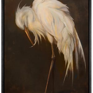 May include: A framed painting depicting a white egret with its head bowed, revealing its long beak and fine feathers. The bird stands on slender legs against a dark brown backdrop, creating a tranquil and elegant artwork.