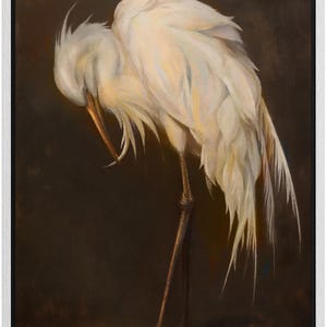 May include: Oil painting of a white egret with its head tucked down, showing detailed feather textures. The bird's long legs and beak are visible against a dark brown background, framed in a white border.