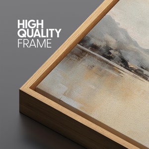 May include: A close-up of a wooden frame surrounding a canvas print with a muted abstract landscape painting. The text "HIGH QUALITY FRAME" is visible in the upper left corner.